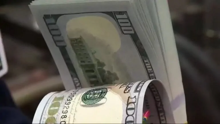 A Close-Up of Rolled $100 Bills Representing Iowa's Economy