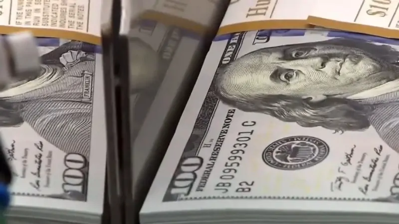 A Close-Up of Stacked $100 Bills, Symbolizing Economic Trends in Iowa's Economy