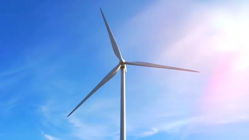 A Wind Turbine Against a Clear Sky, Symbolizing Iowa's Progress in Wind Energy Development