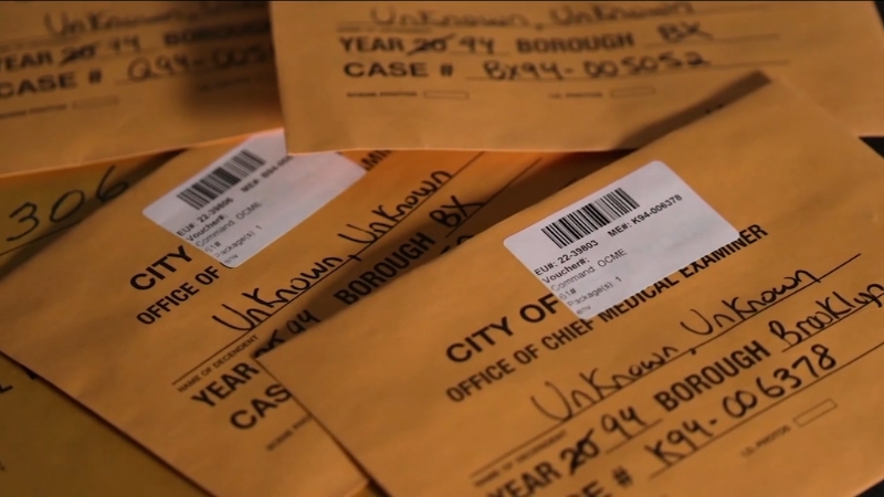 Evidence envelopes labeled unknown from a medical examiner’s office representing unidentified remains cases