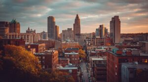 View of an urban skyline with apartment buildings and tree lined streets
